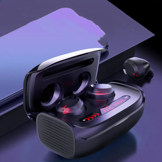A pair of FLIPSTYLEZLLC T11 Wireless Bluetooth Headset 5.0 Earbuds in black, shown with an open charging case featuring red LED lights on a reflective surface, one earbud outside the case, next to a purple item.