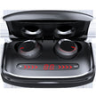 A pair of FLIPSTYLEZLLC T11 Wireless Bluetooth Headset 5.0 Earbuds with red accents rest in an open black charging case, featuring a digital display and arrow indicators labeled 
