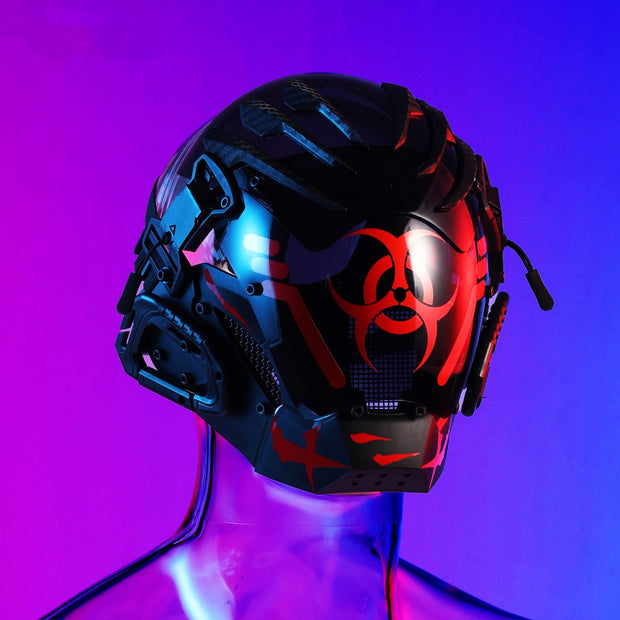 The Dropshipman Bioweapon Tech Mask is a black full-face helmet with red biohazard symbols and electronic details, showcased on a reflective mannequin against a vibrant purple-blue gradient—a striking futuristic party accessory.