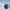 Bass emanating from a black portable Bluetooth speaker 