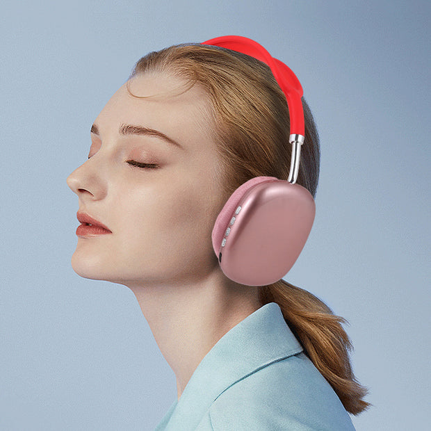 A fair-skinned woman with light brown hair in a ponytail wears large Dropshipman P9 Wireless Bluetooth Headphones, eyes closed and serene, enjoying music against a plain blue background.